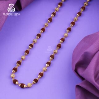 Gold accent Rudraksha mala with spiral decorative beads