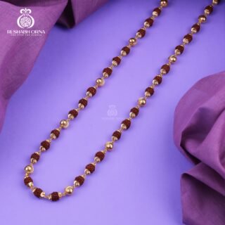 Gold accent Rudraksha mala with decorative spacer beads